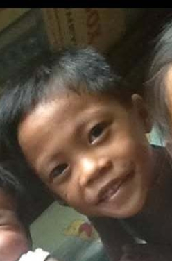 Childhood photo of Neil Anthony R. Adame with his sister